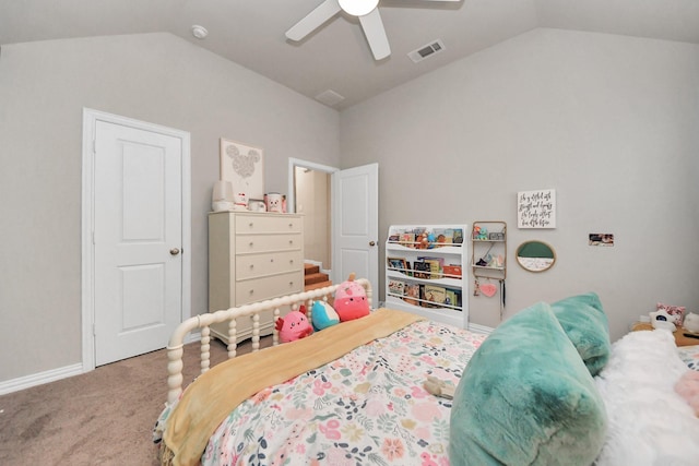 bedroom with a ceiling fan, visible vents, vaulted ceiling, baseboards, and carpet