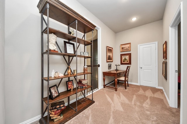 interior space with carpet floors and baseboards