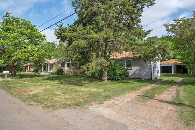 331 Hickerson St, Cedar Hill, TX 75104 - view of front of house featuring a detached garage, driveway, and a front lawn