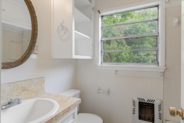 331 Hickerson St, Cedar Hill, TX 75104 - bathroom with heating unit, vanity, toilet, and a wealth of natural light