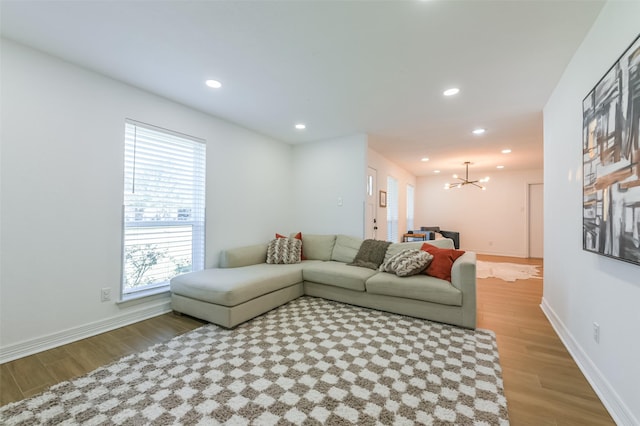 4110 Lou Anne Ln, Houston, TX 77092 - living area featuring a chandelier, wood finished floors, baseboards, and recessed lighting