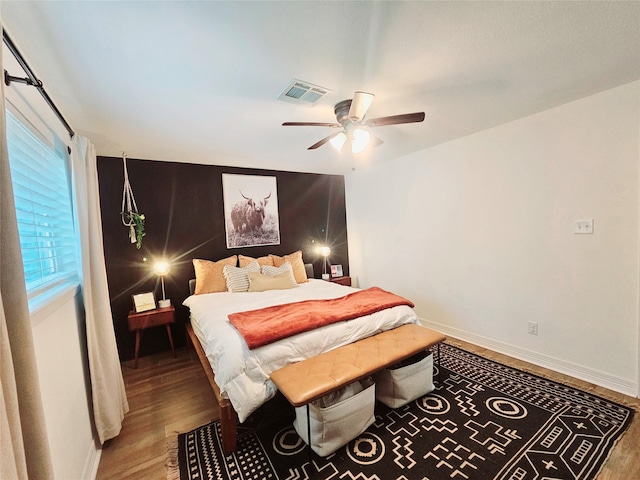 4110 Lou Anne Ln, Houston, TX 77092 - bedroom with wood finished floors, baseboards, and ceiling fan