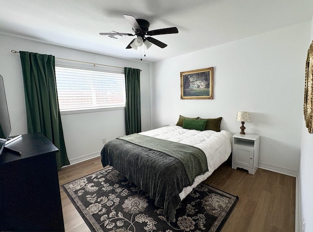4110 Lou Anne Ln, Houston, TX 77092 - bedroom with wood finished floors, baseboards, and ceiling fan