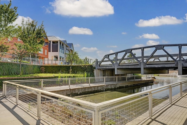 surrounding community with a water view