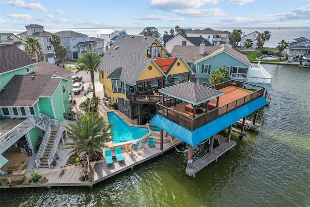 exterior space featuring a residential view and a water view