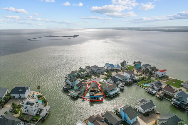 aerial view with a water view and a residential view