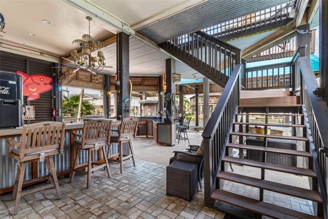 view of patio / terrace with stairway and outdoor dining area