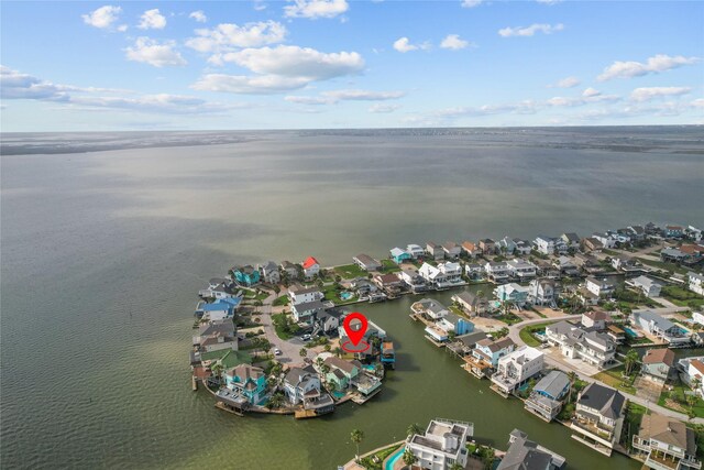 birds eye view of property with a water view and a residential view