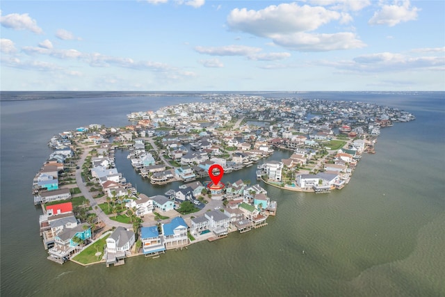 birds eye view of property with a water view and a residential view