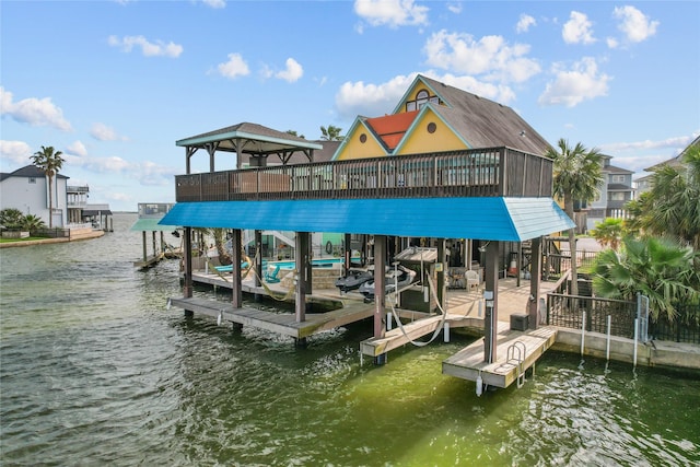 view of dock featuring boat lift and a water view