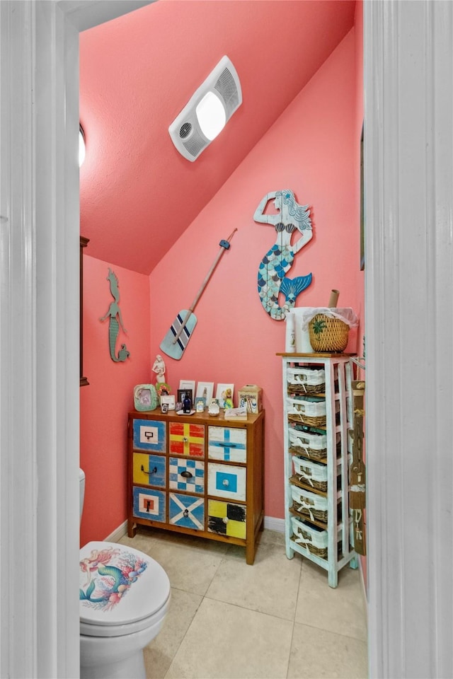 rec room with tile patterned floors and baseboards
