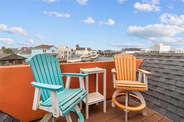 exterior space featuring a water view and a residential view