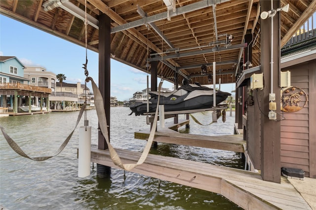 dock area featuring a water view and boat lift