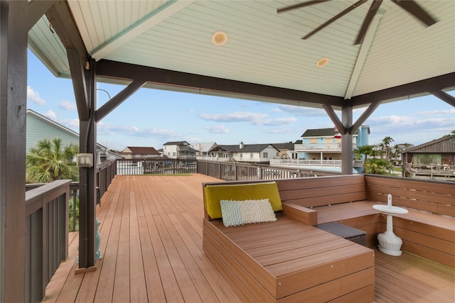 wooden terrace featuring a residential view