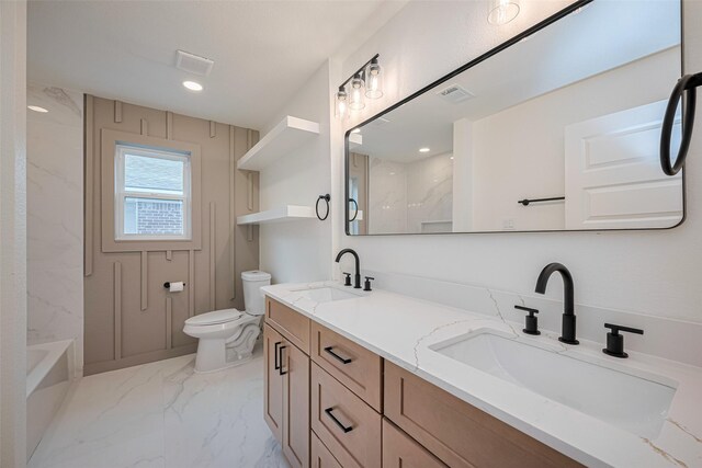 bathroom featuring visible vents, a sink, marble finish floor, and toilet