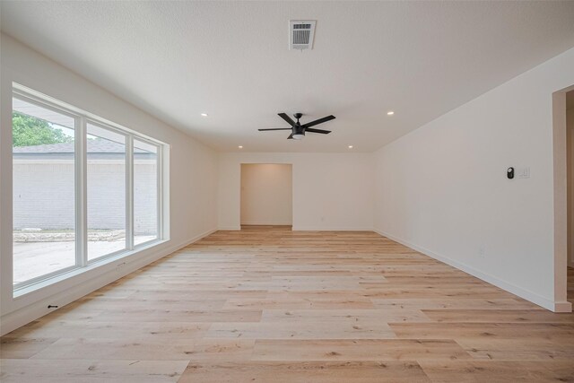 spare room featuring visible vents, a ceiling fan, light wood finished floors, and recessed lighting