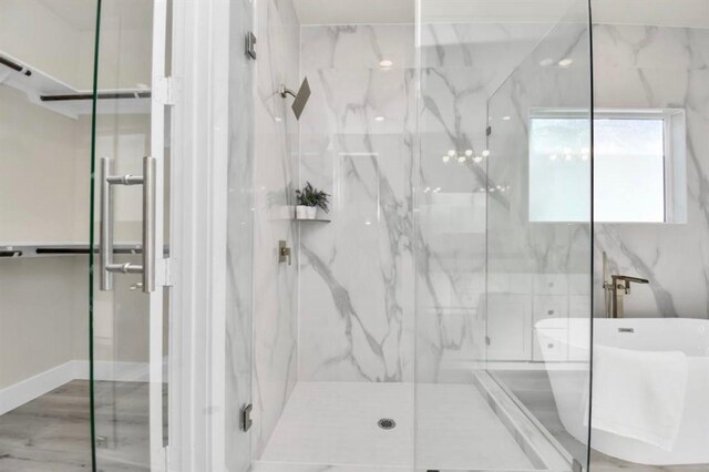 full bath featuring a marble finish shower