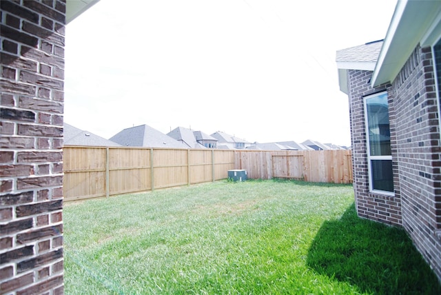 view of yard with a fenced backyard