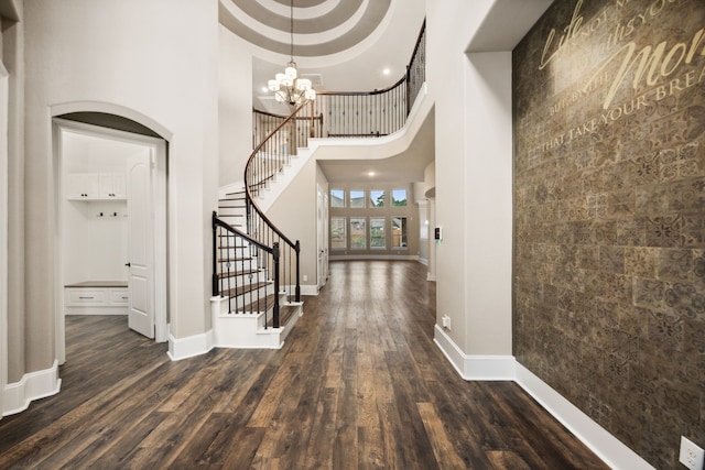 25211 Birchwood Springs Ave, Porter, TX 77365 - entrance foyer featuring dark wood-style flooring, a chandelier, baseboards, a towering ceiling, and stairway