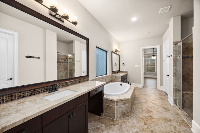 25211 Birchwood Springs Ave, Porter, TX 77365 - bathroom with a sink, decorative backsplash, a shower stall, visible vents, and a bath