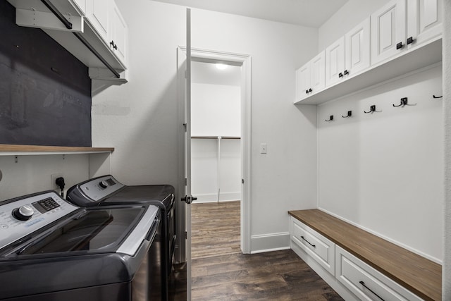 25211 Birchwood Springs Ave, Porter, TX 77365 - laundry room featuring baseboards, dark wood-style floors, cabinet space, and washer and clothes dryer