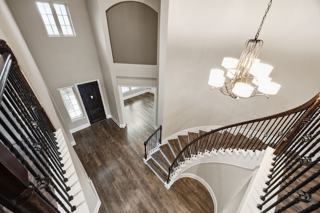 25211 Birchwood Springs Ave, Porter, TX 77365 - foyer entrance with an inviting chandelier, wood finished floors, a healthy amount of sunlight, and stairway