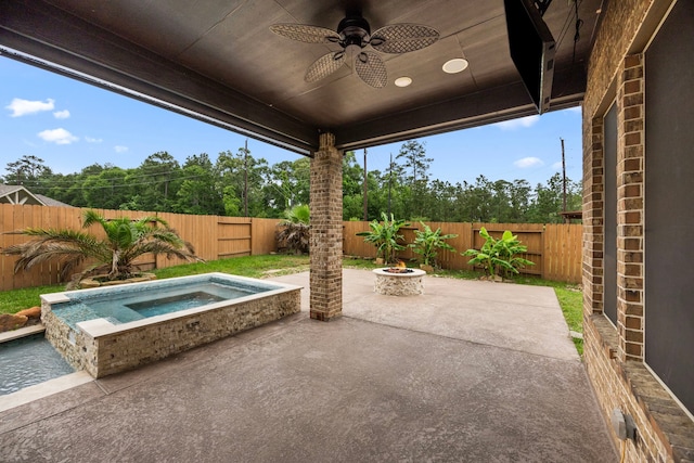 25211 Birchwood Springs Ave, Porter, TX 77365 - view of patio featuring a fenced backyard, an in ground hot tub, a fire pit, and ceiling fan