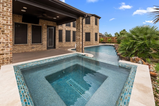 25211 Birchwood Springs Ave, Porter, TX 77365 - view of swimming pool featuring ceiling fan, an in ground hot tub, a fenced in pool, a fenced backyard, and a patio