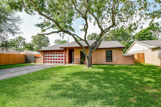 ranch-style house featuring brick siding, a garage, fence, and concrete driveway