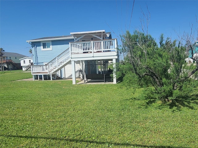 4222 Mason Dr, Galveston, TX 77554 - back of house featuring a yard, a deck, and stairs