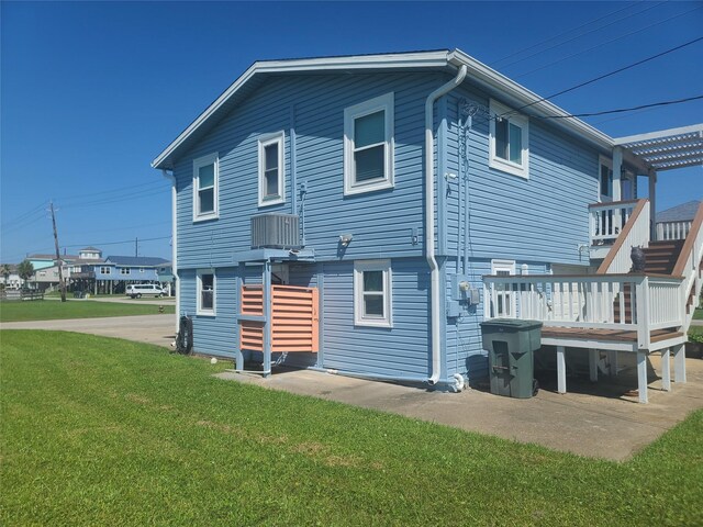 4222 Mason Dr, Galveston, TX 77554 - back of house with a yard