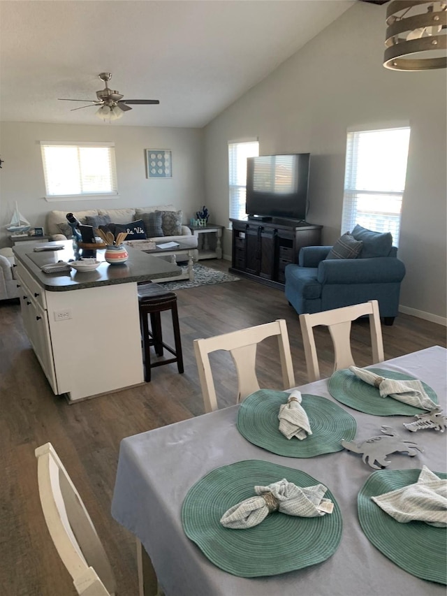 4222 Mason Dr, Galveston, TX 77554 - dining space with ceiling fan, dark wood-style flooring, and a healthy amount of sunlight
