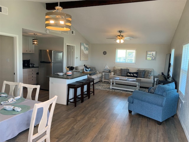 4222 Mason Dr, Galveston, TX 77554 - living area featuring ceiling fan, beamed ceiling, visible vents, and dark wood finished floors