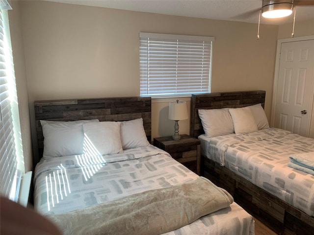 4222 Mason Dr, Galveston, TX 77554 - bedroom featuring ceiling fan and multiple windows