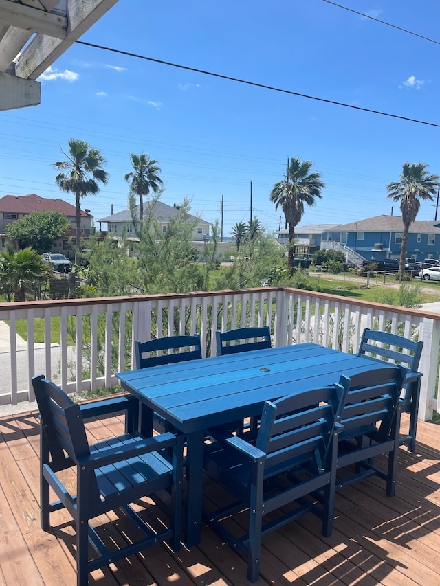 4222 Mason Dr, Galveston, TX 77554 - wooden deck featuring outdoor dining area