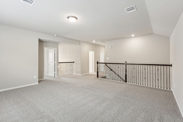 empty room featuring visible vents, recessed lighting, baseboards, and carpet floors