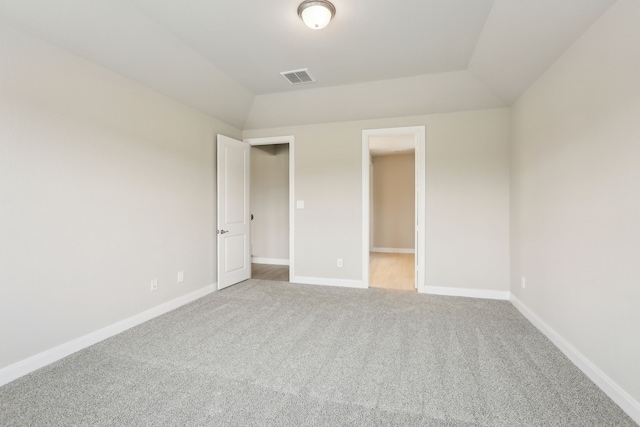 unfurnished bedroom with visible vents, baseboards, and carpet floors
