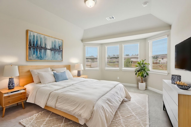 carpeted bedroom with visible vents and baseboards