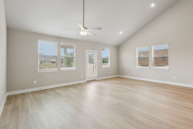 unfurnished living room with a ceiling fan, baseboards, light wood finished floors, lofted ceiling, and recessed lighting