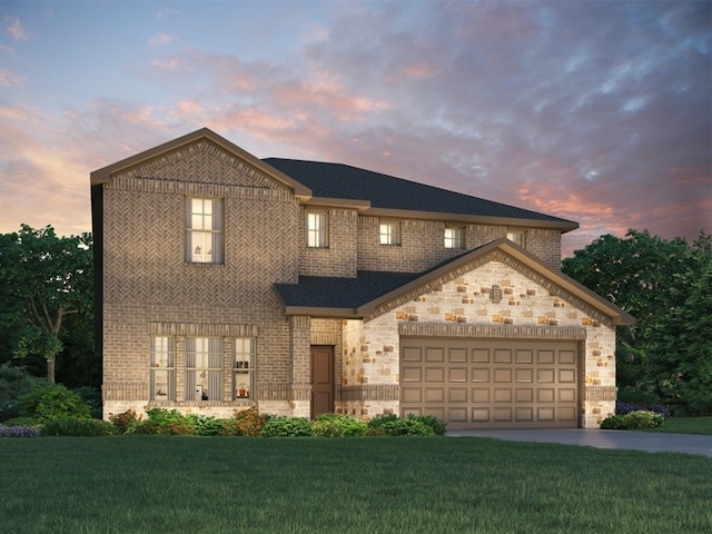 view of front facade featuring an attached garage, concrete driveway, a front yard, and brick siding