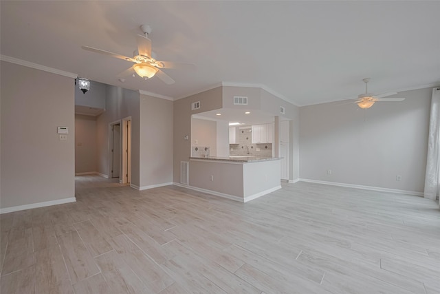 unfurnished living room with visible vents, ornamental molding, baseboards, a ceiling fan, and light wood finished floors