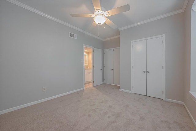 unfurnished bedroom with crown molding, baseboards, and visible vents