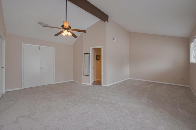 unfurnished bedroom featuring visible vents, baseboards, carpet floors, and beam ceiling