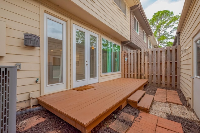 exterior space with french doors and fence