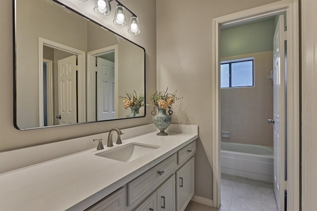 bathroom with vanity, baseboards, shower / bathing tub combination, and tile patterned flooring