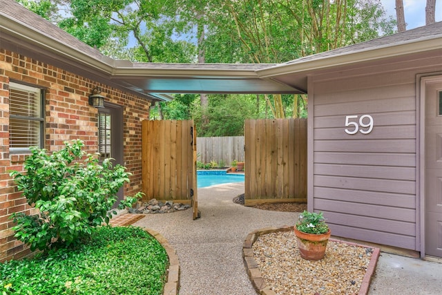 view of patio / terrace featuring a fenced in pool and fence