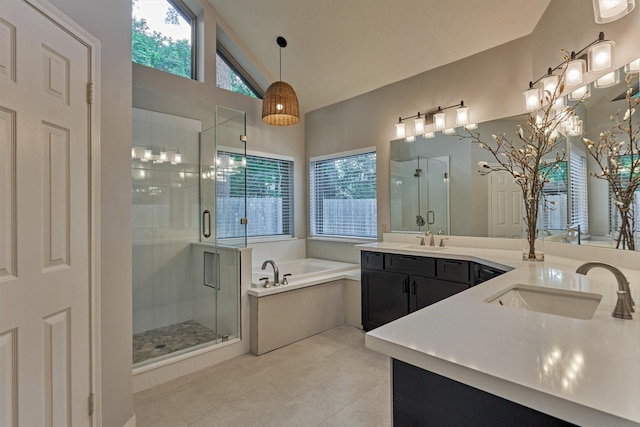full bathroom featuring a sink, a shower stall, and a garden tub