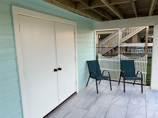 balcony featuring stairway