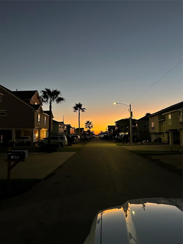 view of street with a residential view and street lights