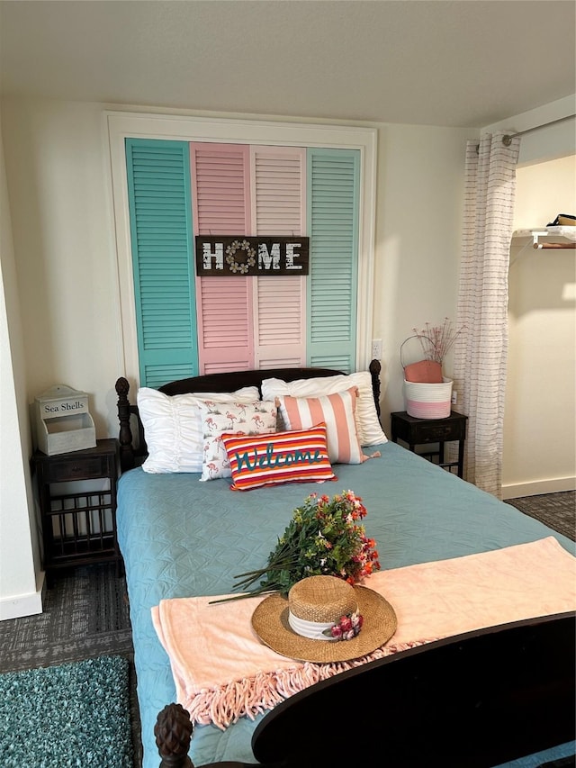 bedroom featuring baseboards and carpet floors
